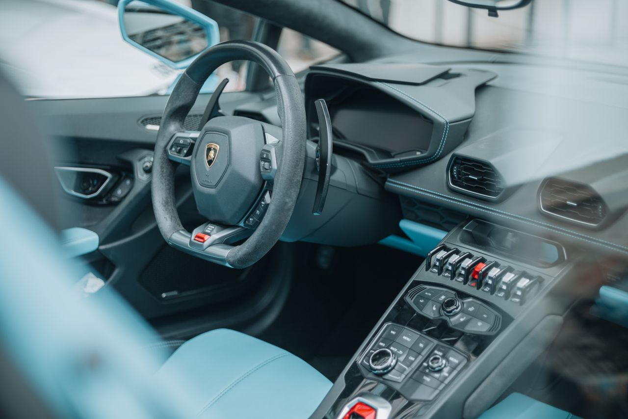 Explore the sleek interior of a luxury sports car shot in Cluj-Napoca, Romania, showcasing modern design and sophistication.